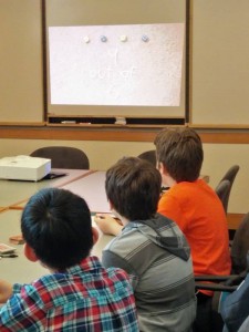 Kids intently listening about probability.