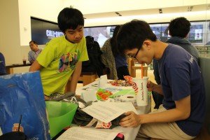 Steven helping solve problems over Jamba Juice.